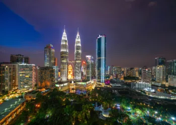 Kuala Lumpur skyline at night with view of Petronas Towers