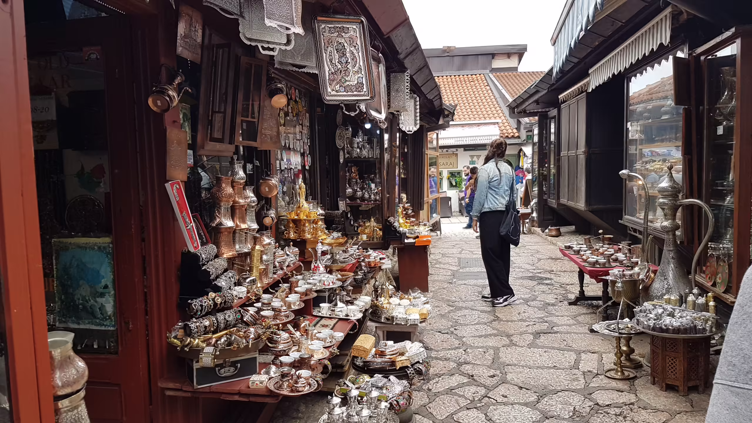 A narrow alleyway with souvenir shops in Baščaršija, Sarajevo Old Town.