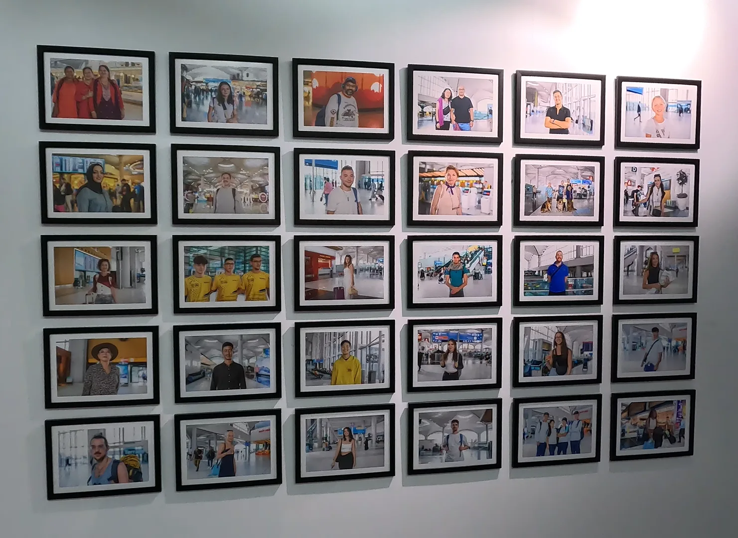 Various portrait photos of passengers who've passed through Istanbul Airport, as part of the “The Faces of İGA / I Am Where I Stand” exhibition.