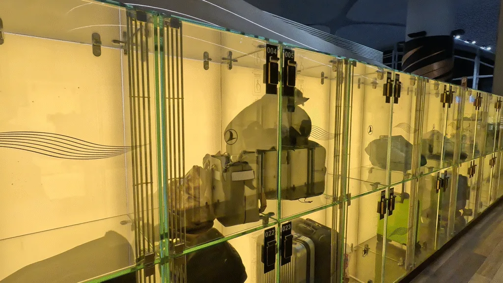 Transparent glass lockers with bags, luggage and passenger belongings in different lockers, Turkish Airlines Business Lounge, Istanbul Airport.